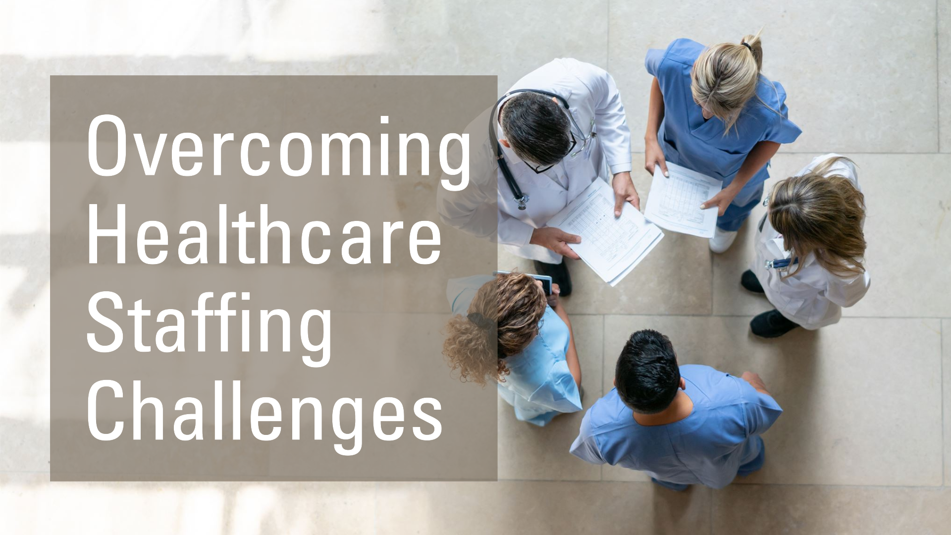 A group of healthcare professionals in scrubs and lab coats stand in a circle discussing documents. The text "Game Changer: Overcoming Healthcare Staffing Challenges" is displayed on the left side of the image.