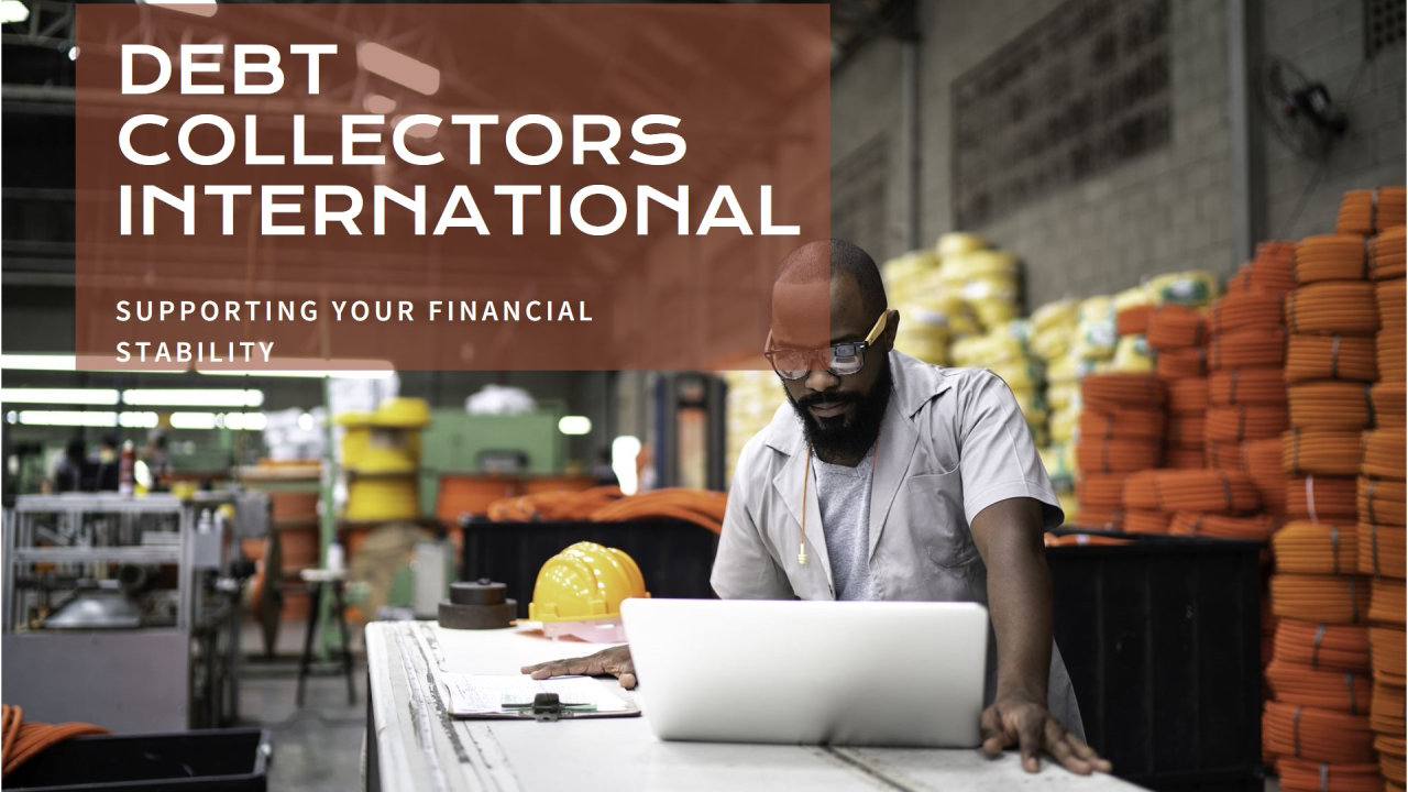 A person works on a laptop in a warehouse filled with stacked yellow and orange items. A safety helmet is on the table. Text reads: "Debt Collectors International: Supporting Your Financial Stability.